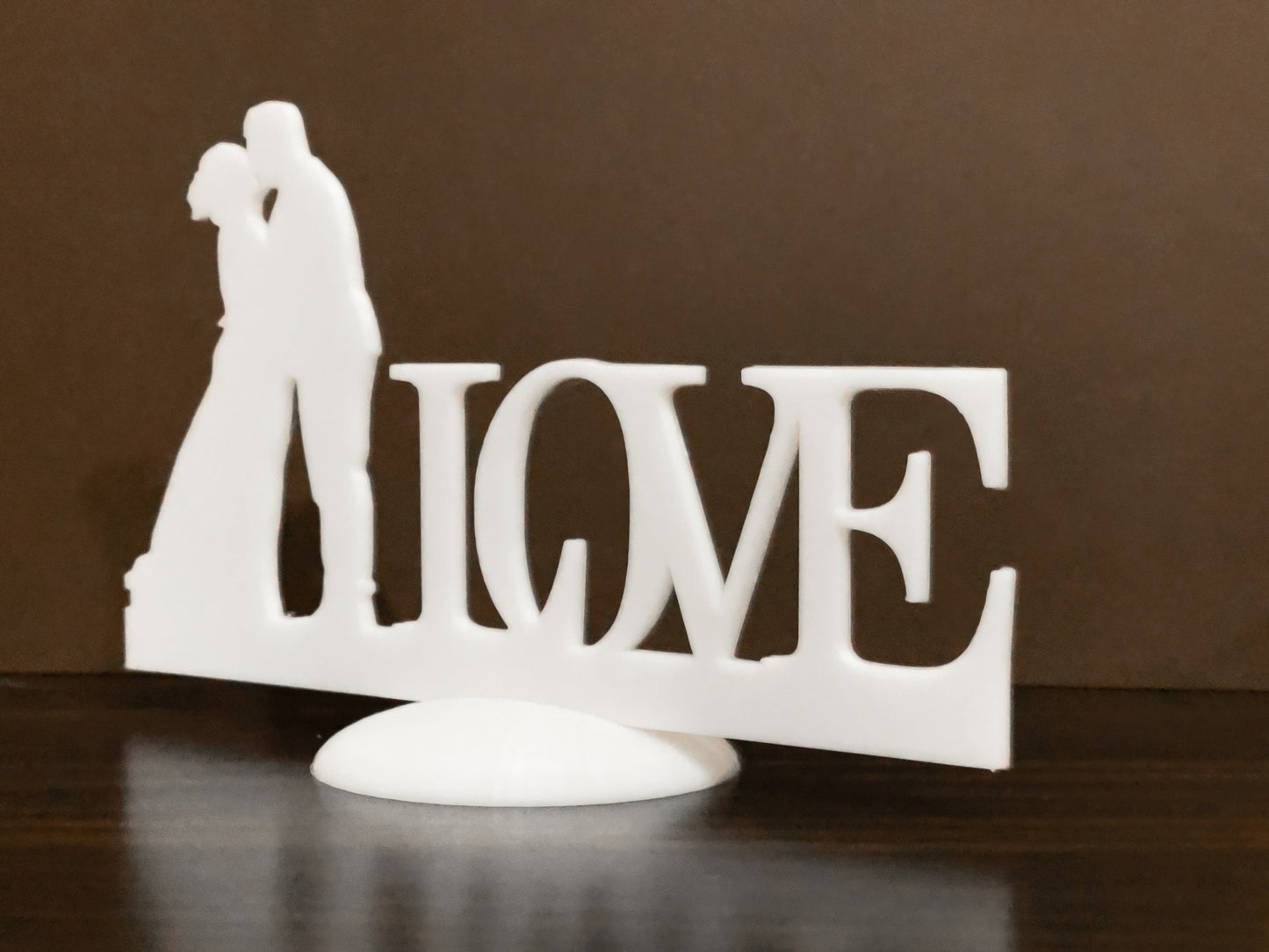 Wedding stand with kissing couple Love